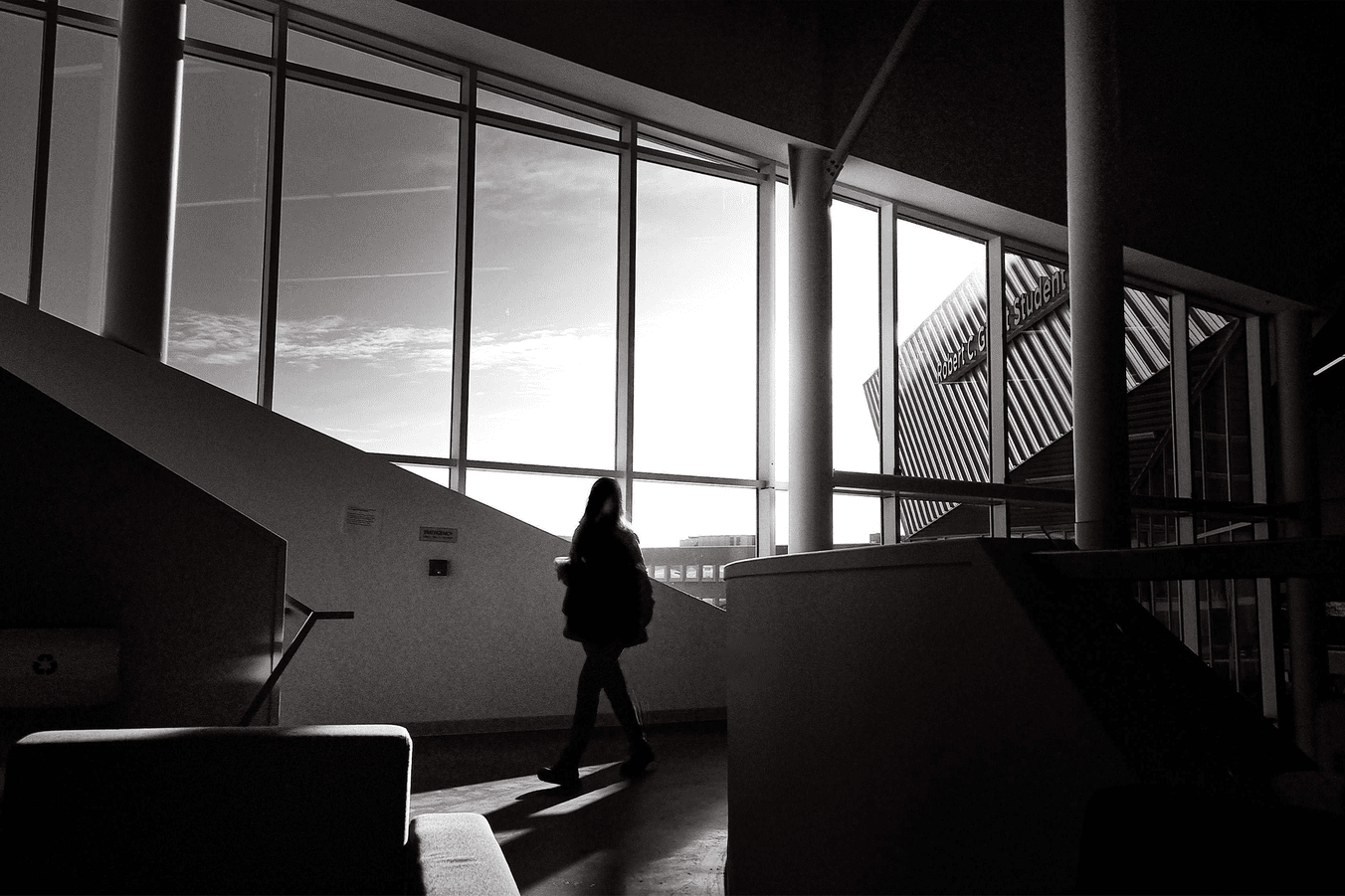 Woman walking at building E